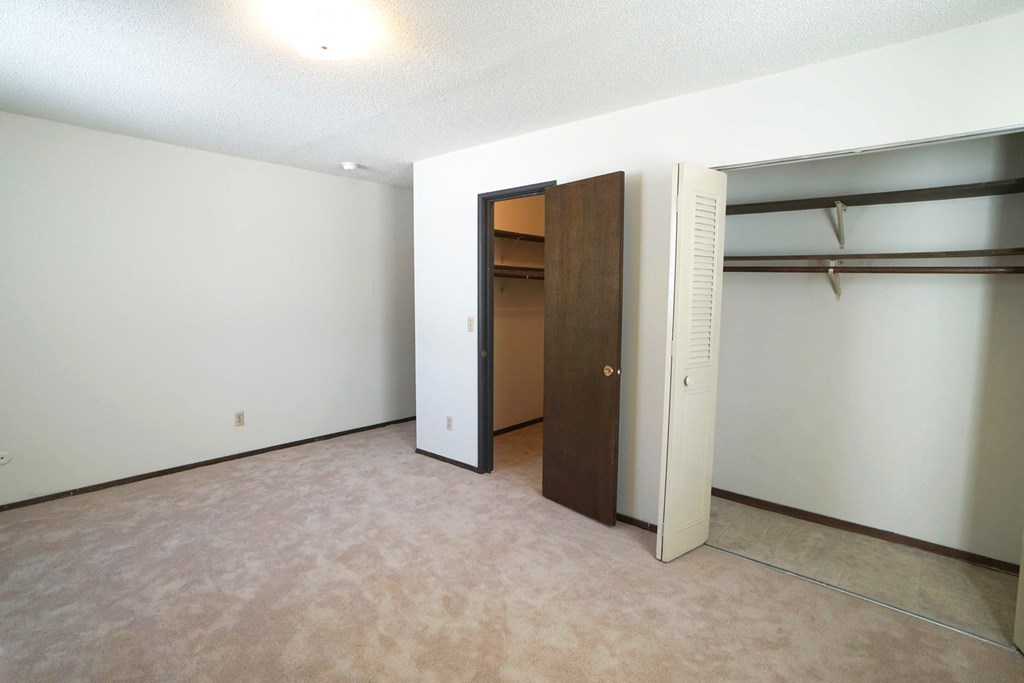 Arlington Place bedroom closet to the right and door to the center left