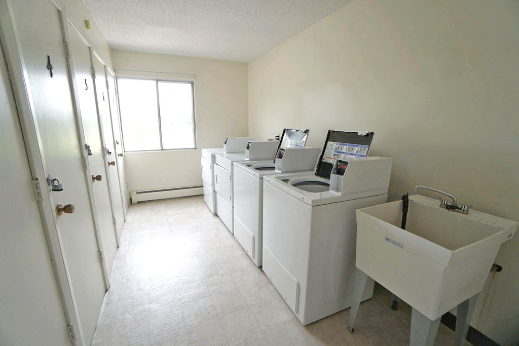 Arlington Place laundry washing machines on the right