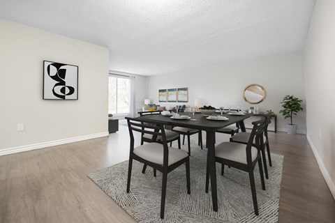 A dining room with a table set for six.