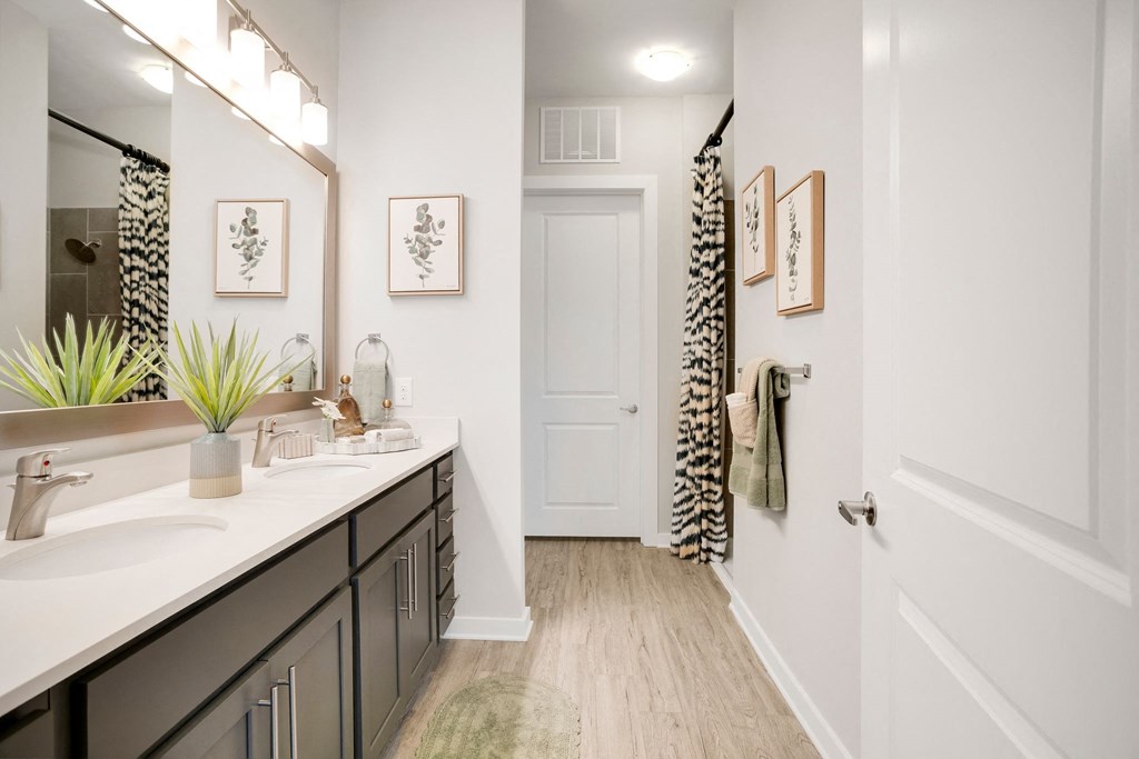 A Bathroom With a White Door at The Aster Apartments, North Carolina, 27519