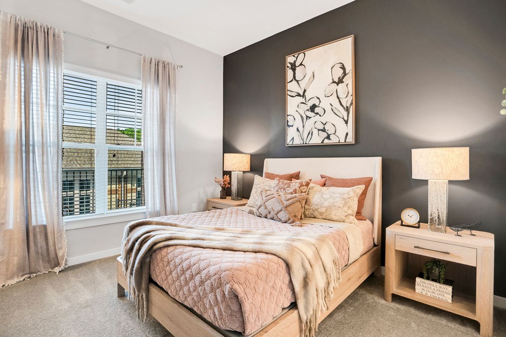 A Bedroom With a Window and Curtains at The Aster Apartments, Cary, NC, 27519
