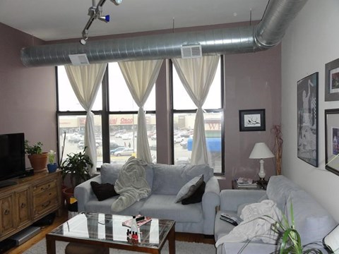 a living room with a couch and a table