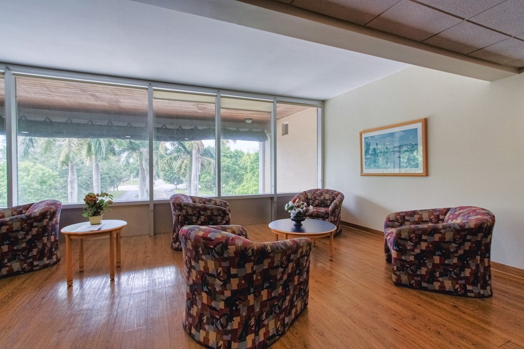sitting area beside large windows at Villa Madonna