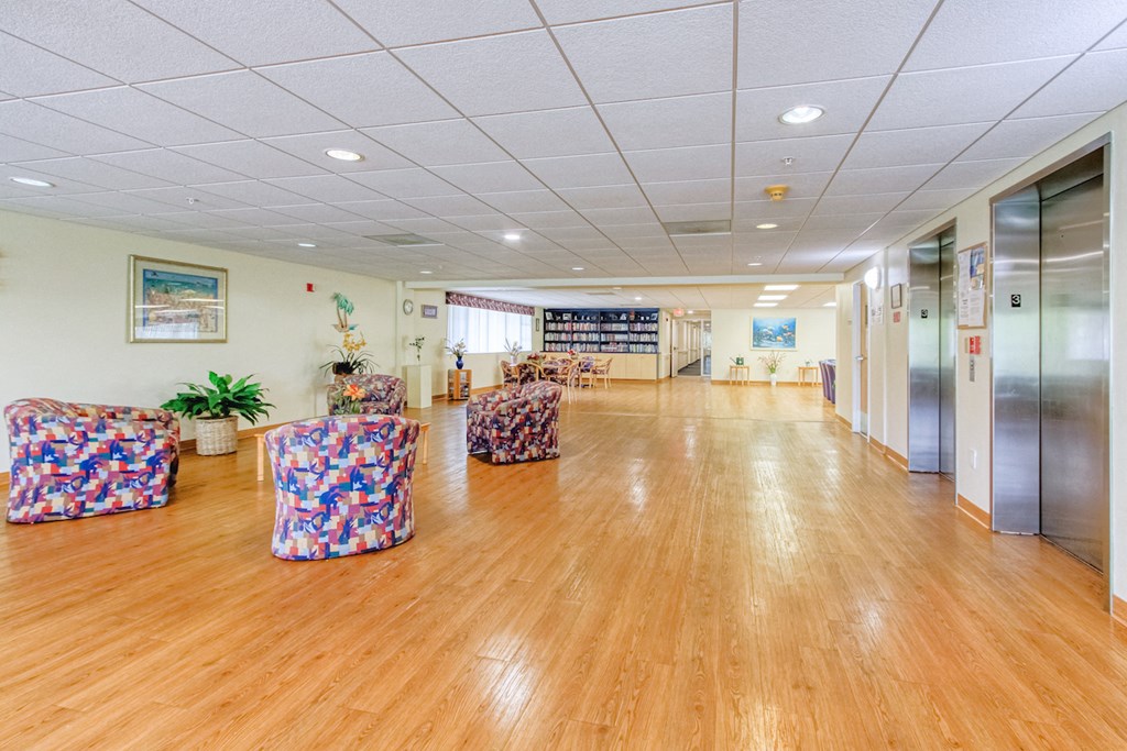 large open seating area beside elevator banks