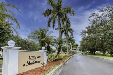 Monument sign at entrance of Villa Madonna Senior Apartments