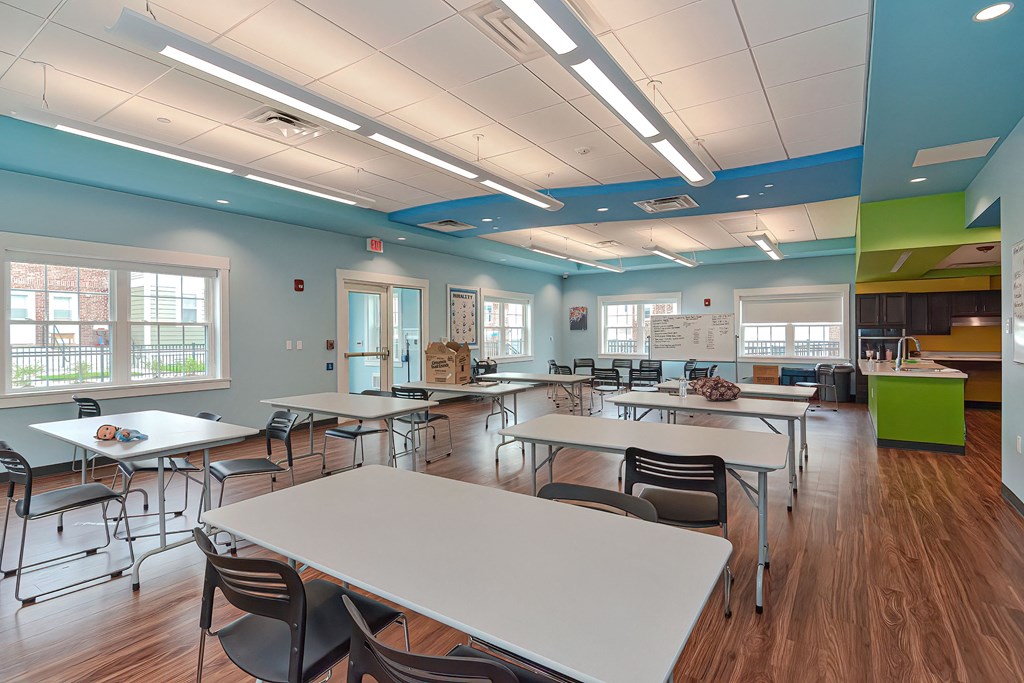 a dining room with tables and chairs in a classroom