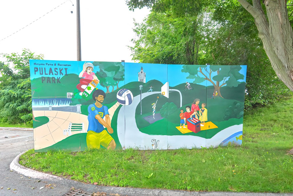 a colorful mural on the side of a road