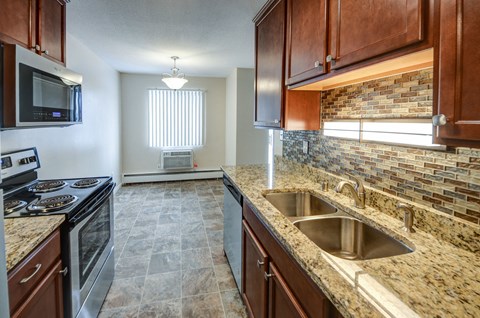 a kitchen with granite counter tops and a sink