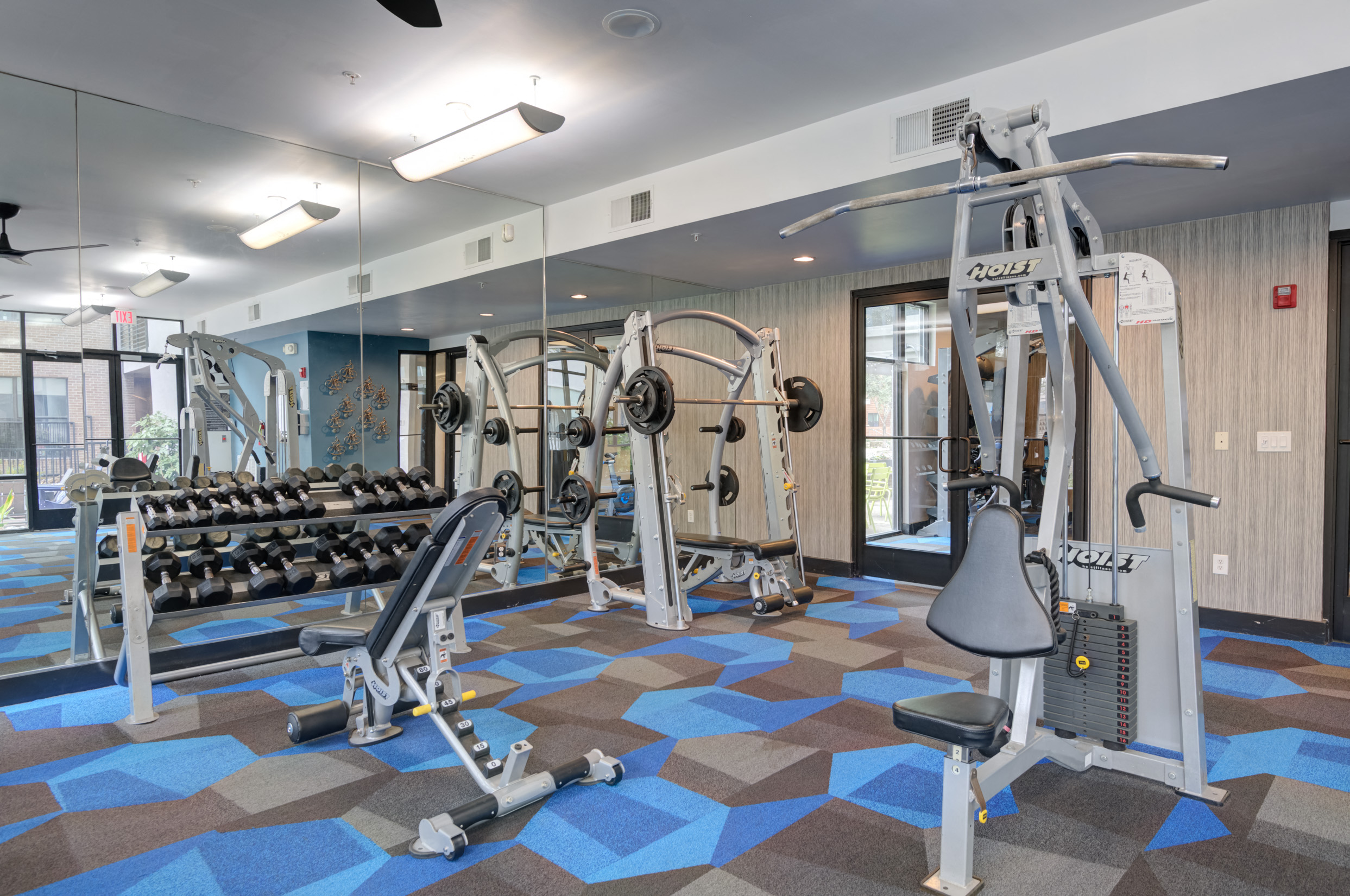 a gym with weights and cardio equipment at the enclave at woodbury