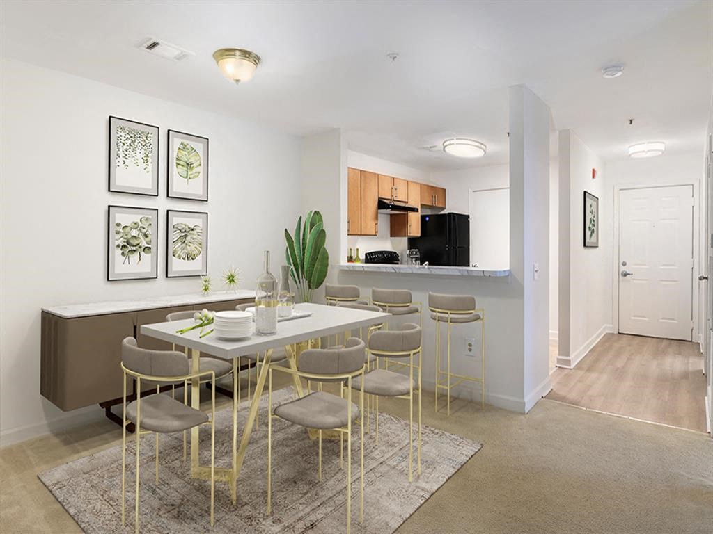 a dining room and kitchen with a table and chairs