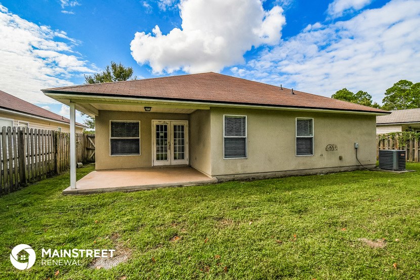 a home with a lawn and a patio