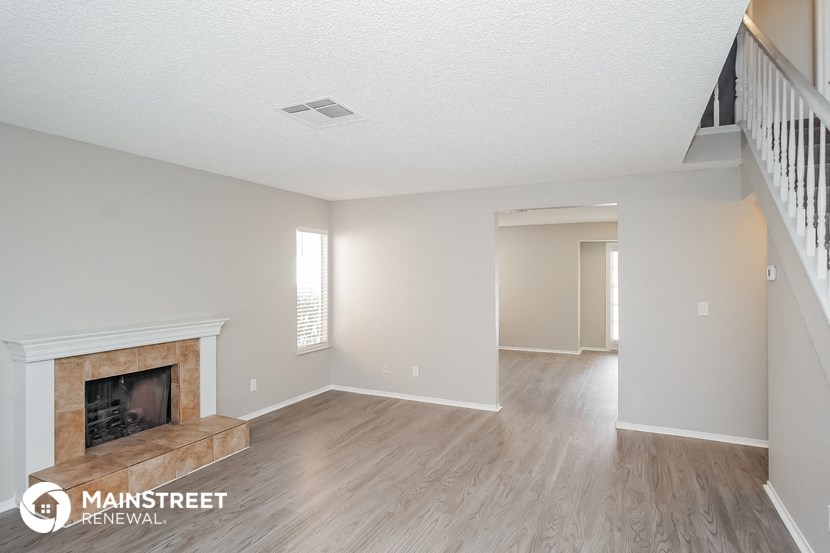 the living room and dining room with fireplace