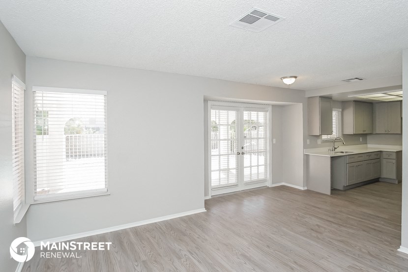 the living room and kitchen of an apartment