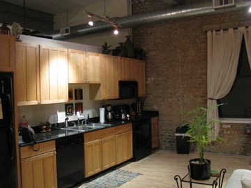 a kitchen and living room in a loft