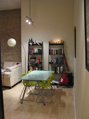 a dining room with a table and chairs