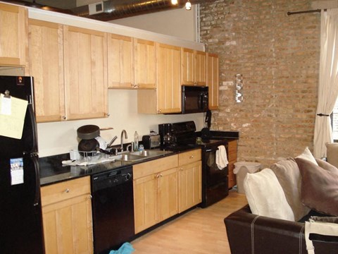 a kitchen with a stove sink and refrigerator
