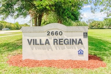 Monument sign in front of Villa Regina Senior Apartments