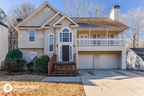 a home with a front porch and a garage
