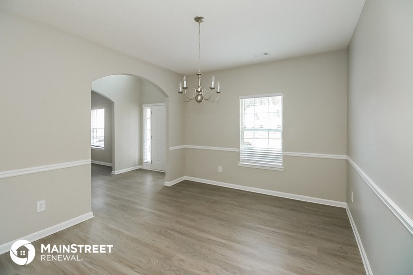 the living room and dining room in a 367 repurposed residence
