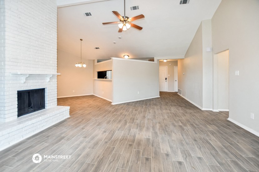 the living room and dining room with fireplace