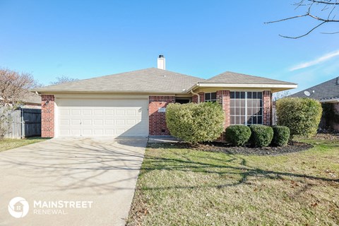a home with a driveway and a garage door