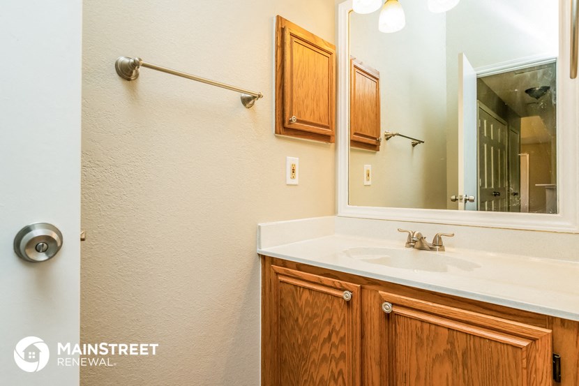 a bathroom with a sink and a mirror