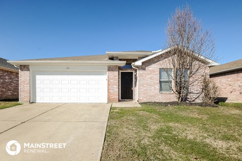 a brick house with a white garage door