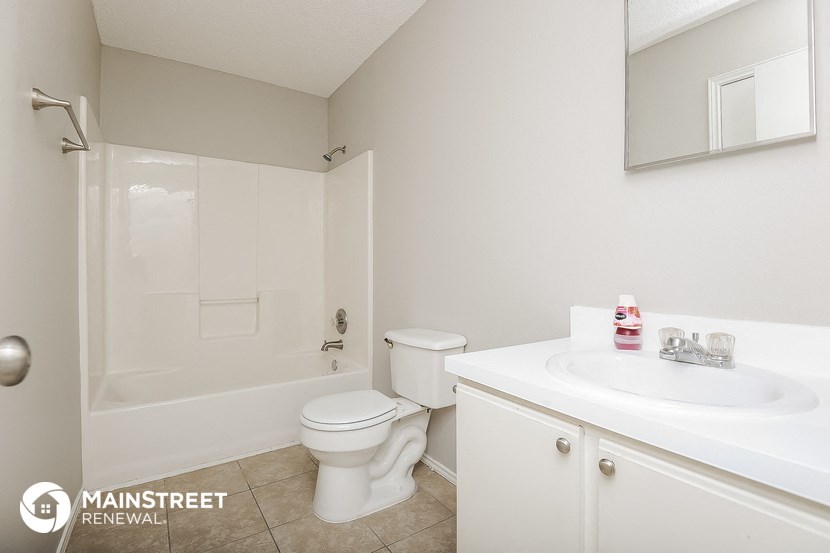 a bathroom with a sink toilet and a shower