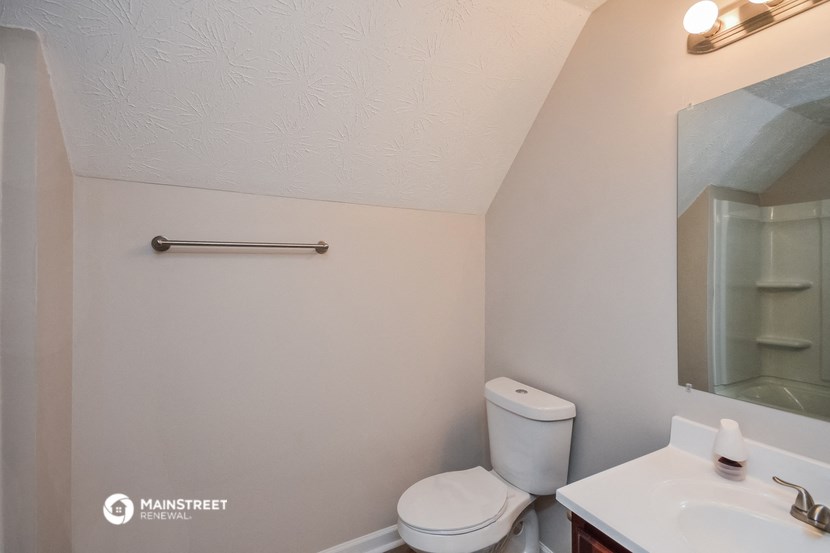 a small bathroom with a toilet and a sink