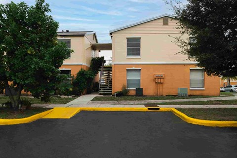 A building with a yellow curb in front of it.