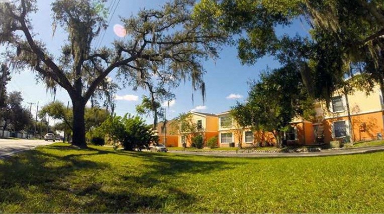 a row of houses on the side of a street