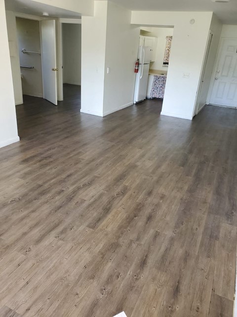 a living room with a hard wood floor