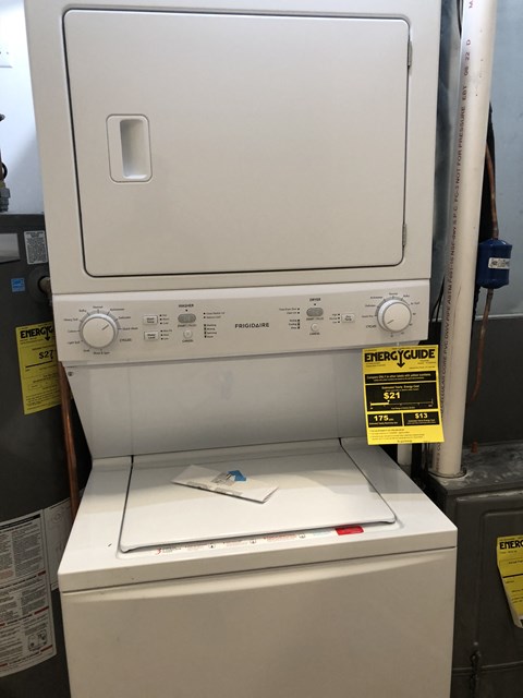 a piece of paper sitting on top of a washing machine