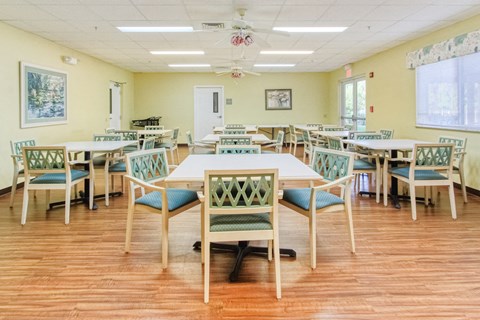 a dining room with tables and chairs