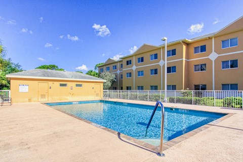 sparkling swimming pool with large sundeck