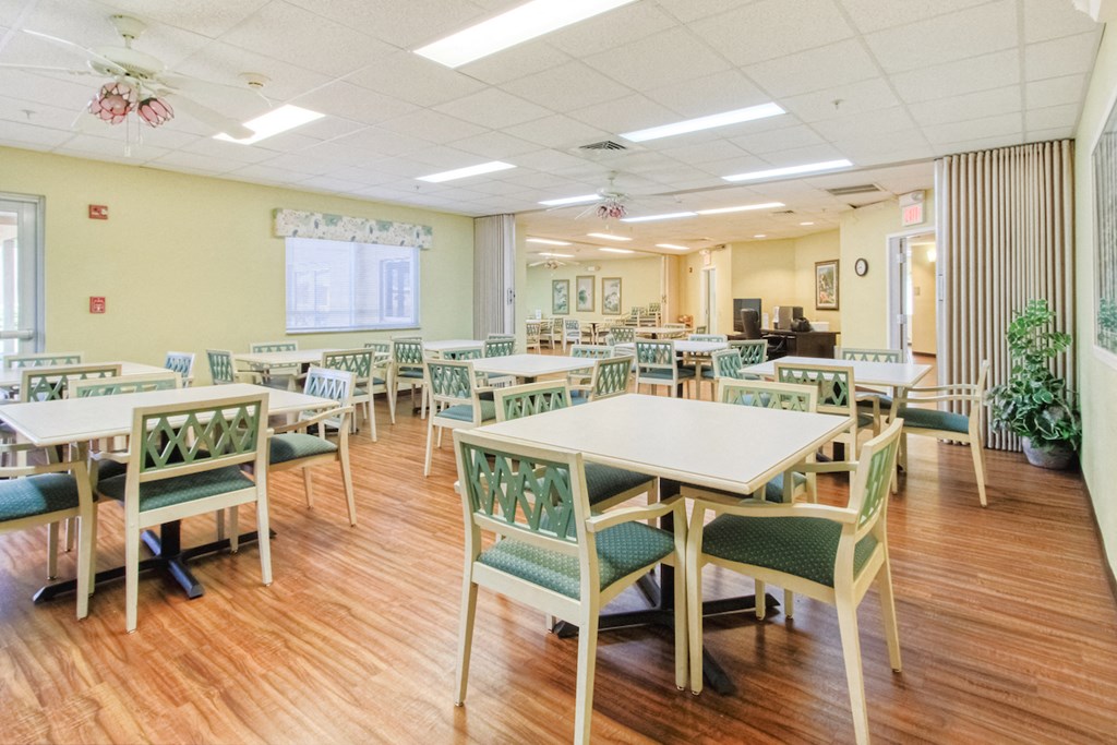 community room with several tables and chairs