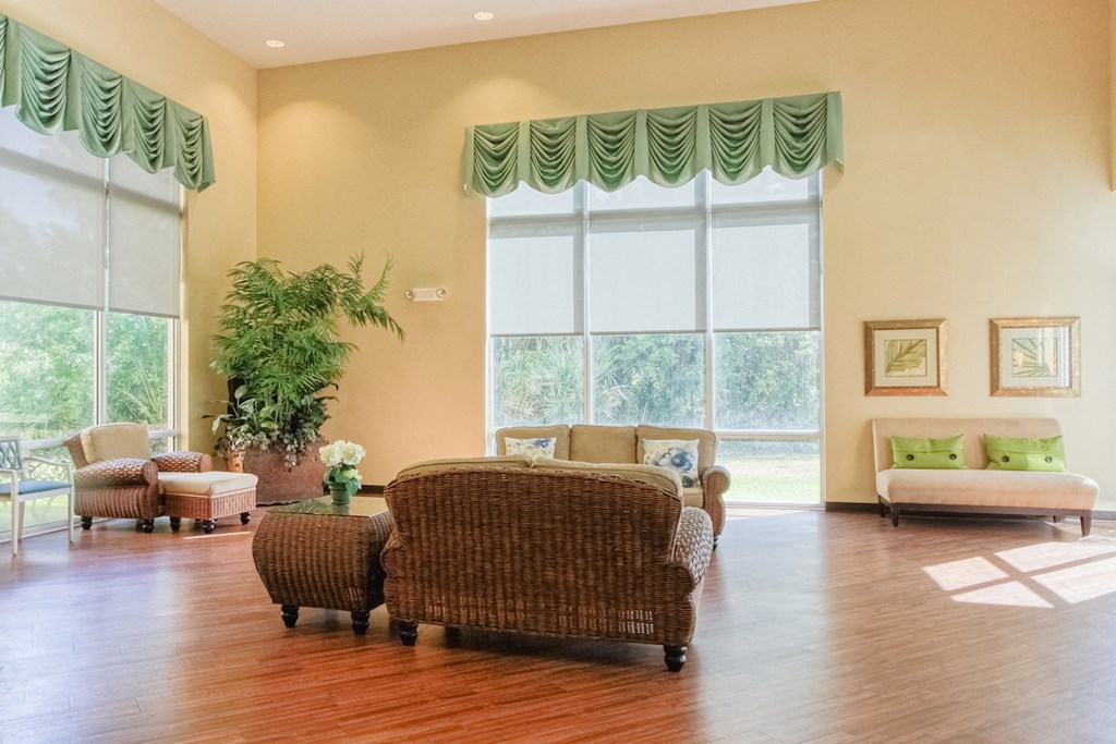 Lobby with large windows, natural light, and comfortable seating