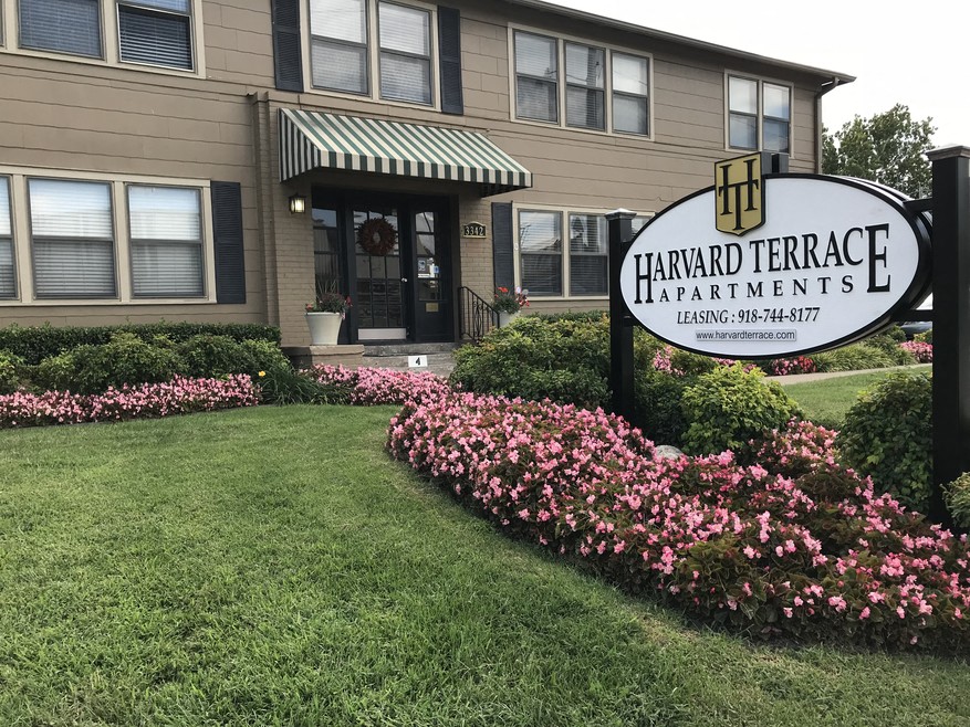 a building with a sign apartments