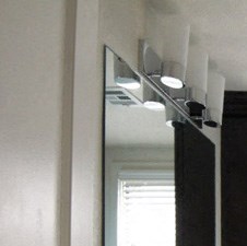 a bathroom with a sink and a toilet and a mirror