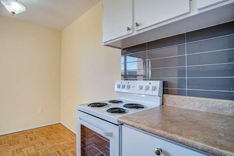 a kitchen with a stove and a counter top