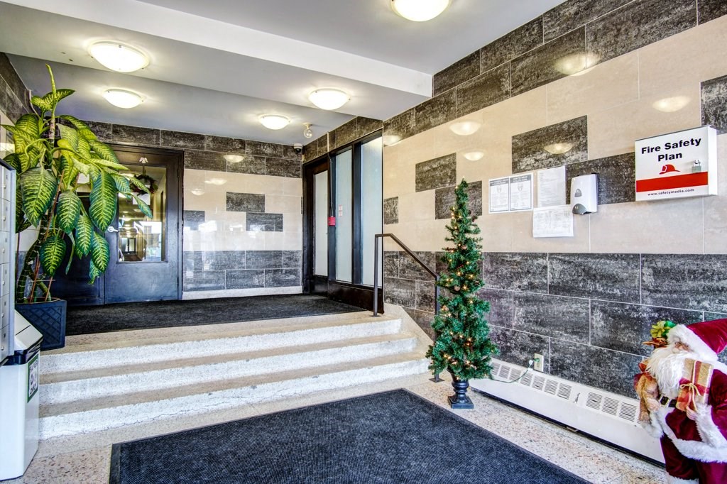 a christmas tree in the lobby of a building