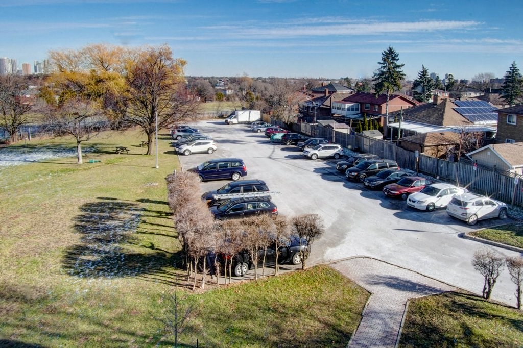 an aerial view of a parking lot with cars parked