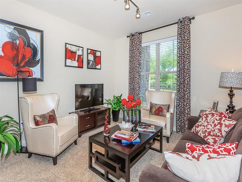 a living room with a couch and a television