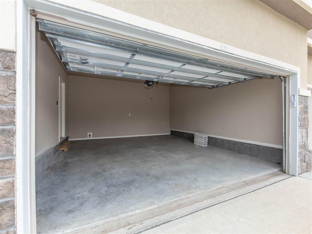 an empty garage with an open door