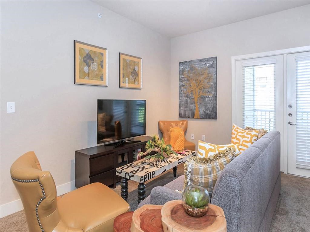 a living room with a couch and a television