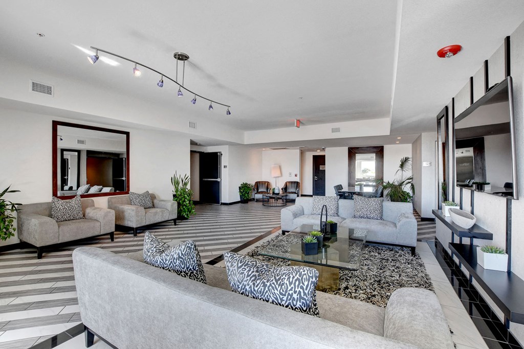 a living room with couches and chairs and a table