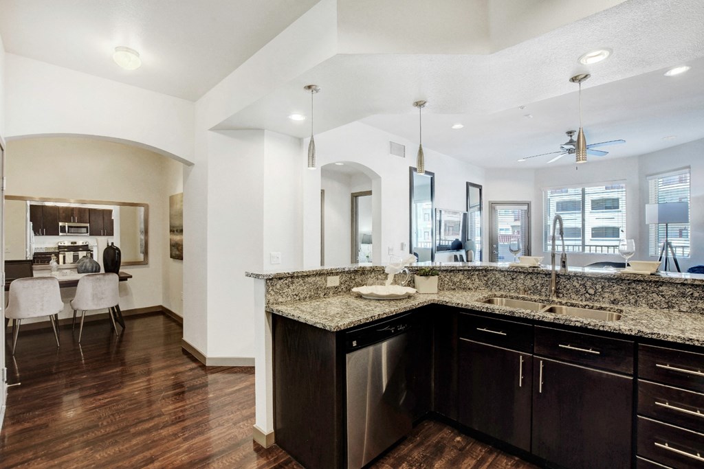 a kitchen with granite counter tops and a sink