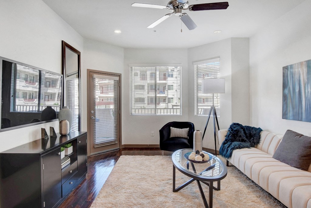 an empty living room with a couch and a table