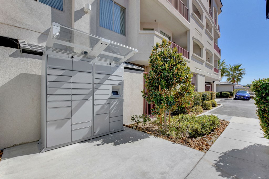a garage door in front of an apartment building with a driveway