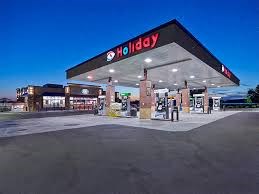 a gas station is lit up at night